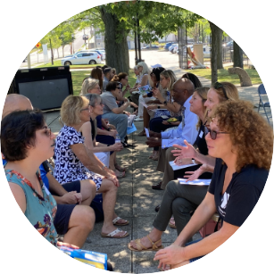 Two columns of inter-generational participants look across at one another