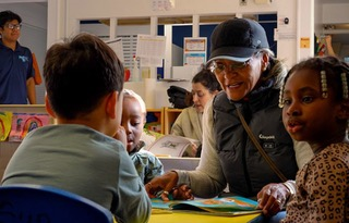 Participant in Princeton's Grandpa's program working with school kids