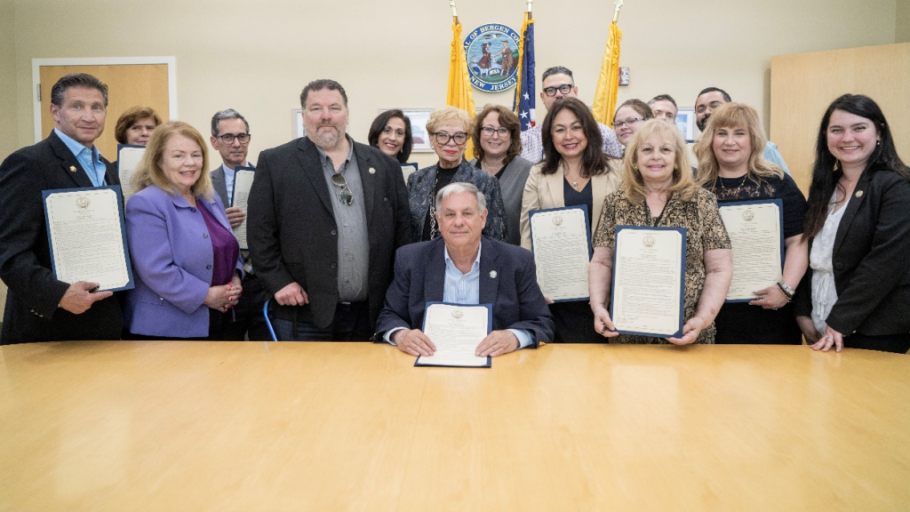 Members of the Bergen County Age-Friendly Task Force posing with copy of Board of Commissioners resolution